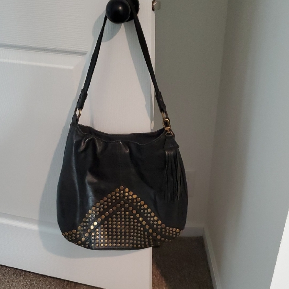 The Sak Black Hobo with Gold Stud Accents and Tassel